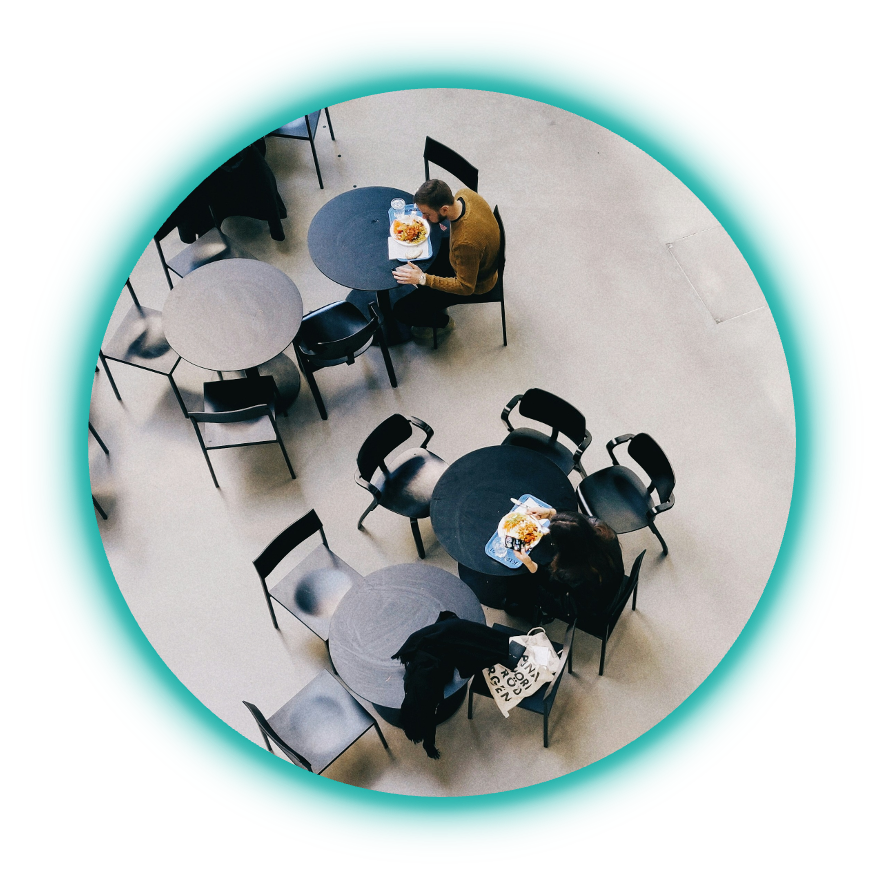 Two people eating in a canteen