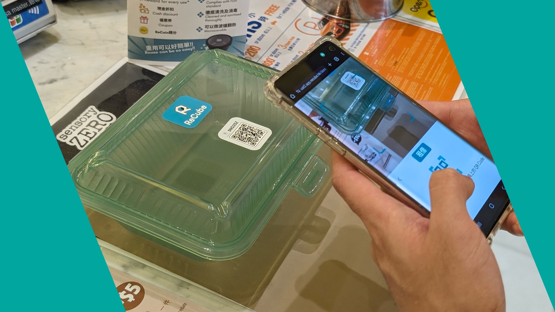 A person scanning the ReCube sustainable container using ReCube App